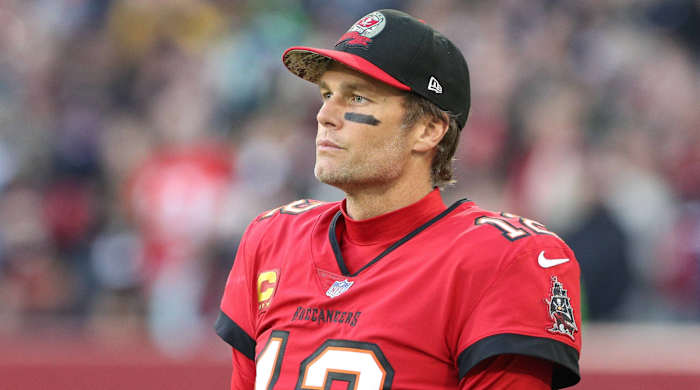 Buccaneers quarterback Tom Brady looks on from the sidelines without a helmet during a game in Germany vs. the Seahawks.